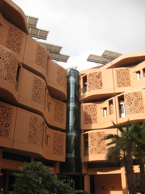 Another Masdar City apartment building with solar panels on top. Credit: Zachary Shahan.